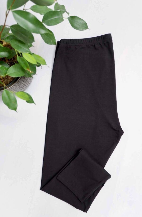 Flat lay image of folded black Blooming Marvellous maternity leggings.