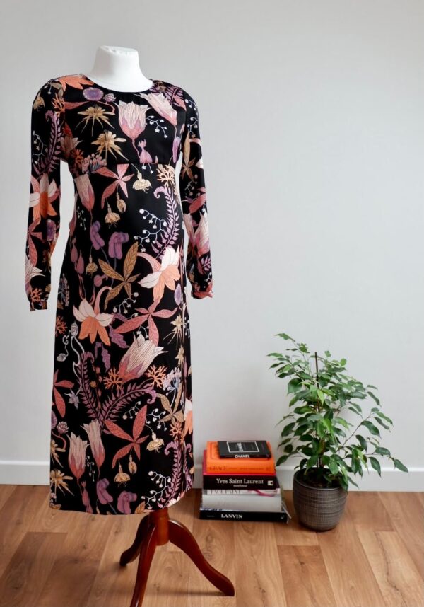 Full length image of H&M maternity pink and black floral patterned dress