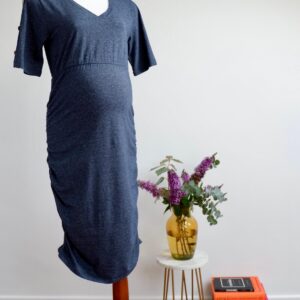 Image of dark blue maternity dress with short sleeves on a mannequin