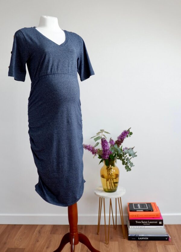 Image of dark blue maternity dress with short sleeves on a mannequin