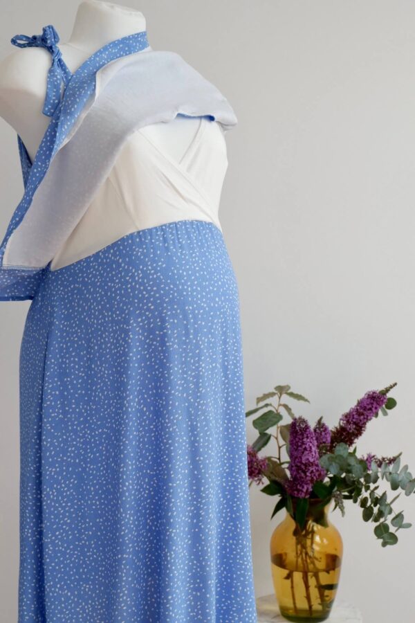 Light blue maternity summer dress with white polka dots on a mannequin showing nursing function